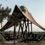 wooden ‘mirador aula’ is suspended above protected forest in ecuador