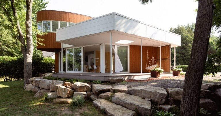 paul bernier architecte nestles a modest chalet among the trees of oka, canada
