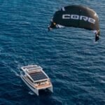 the SILENT 60 electric catamaran features a kite wing and 42 solar panels
