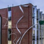 alex chinneck unveils 25-meter-high spiraling sculpture in brighton, uk