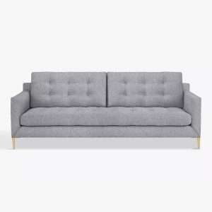 A grey three seater sofa with wooden legs
