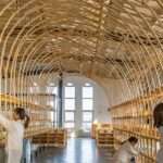 LUO studio bends wood panels into spellbinding exhibition show