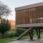 this home by barrionuevo villanueva arquitectos floats amongst argentina’s forested hills