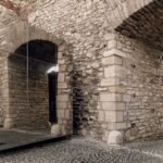 these reflective kiosks in budapest seamlessly mix into their historic environment