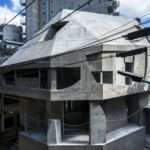 AAOAA disrupts architectural conventions with irregular concrete building in tokyo
