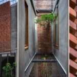 andyrahman + cipta hadi front indonesian boarding house with interwoven bricks
