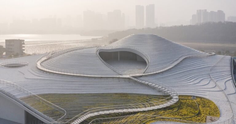 atelier deshaus tucks its qintai art museum beneath an undulating, stepped topography