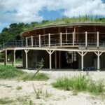 cloud architects weaves circular kiosk into the lush mountainous landscape of japan