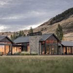 A Material Palette Of Cedar, Stone, And Metal Contribute To The Charm Of This Farmhouse-Inspired Home