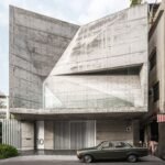 a folding concrete shell wraps the terraced gardens of atelier gratia’s ‘star house’