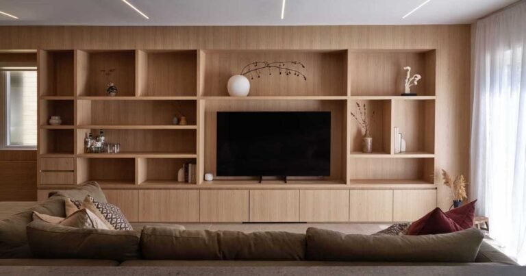 Wall-To-Wall Built-In Wood Cabinetry Create A Warm Interior For This Renovated Home