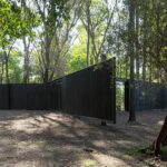 triangular ‘archipelago pavilion’ designed for flexible use in woods of argentina