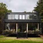 Plants Are Encouraged To Grow Over The Exterior Of This New House