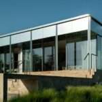 reflective aluminum framework crowns the clifftop house by KONTEXTUS in hungary