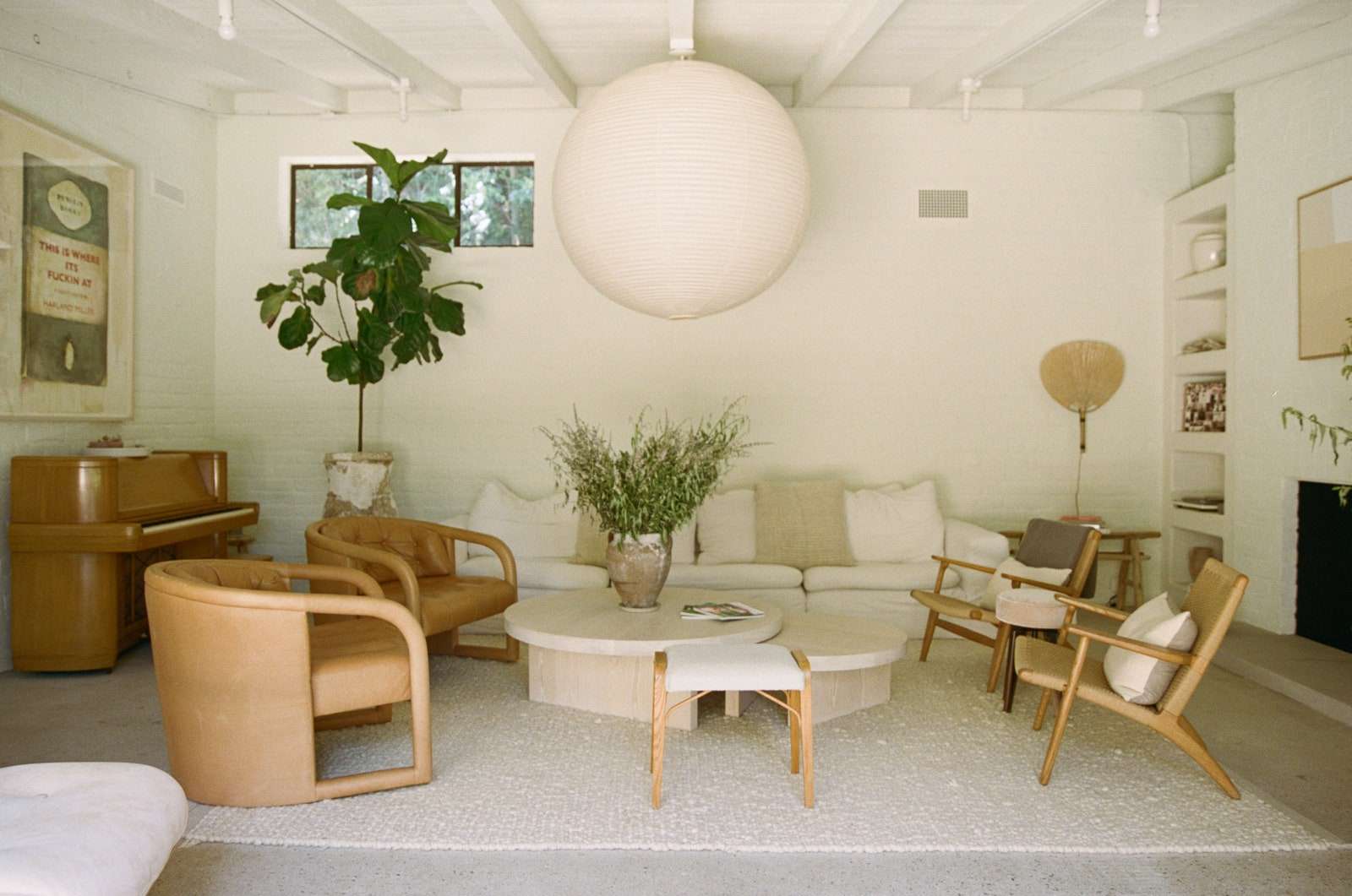 AFTER Camillas favorite vintage find was a restored Jesse French and Sons piano that sits next to RHs Cloud Couch Design...