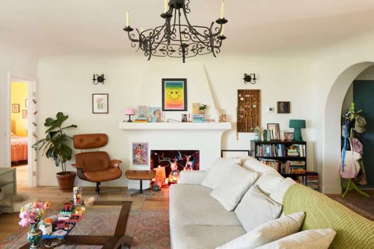 The living rooms mantel is a space for some of Caities favorite things including an issue of Playgirl with Robert...