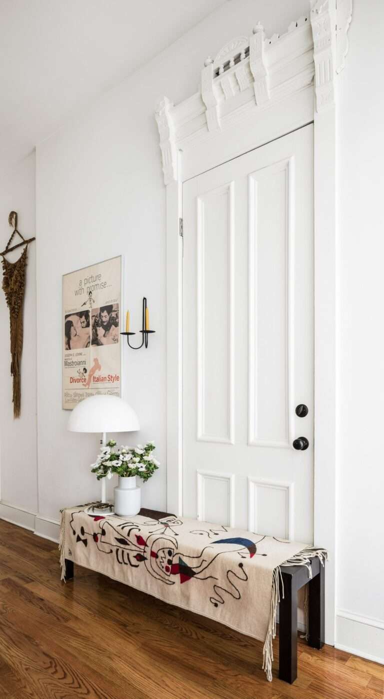 In the living room a Bjursta bench from IKEA wears a handloom Oaxaca rug. Dubbed “the sofa” it acts to mask the door...