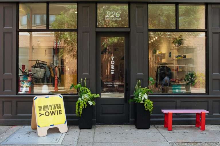 A red and pink bench outside the Yowie storefront.