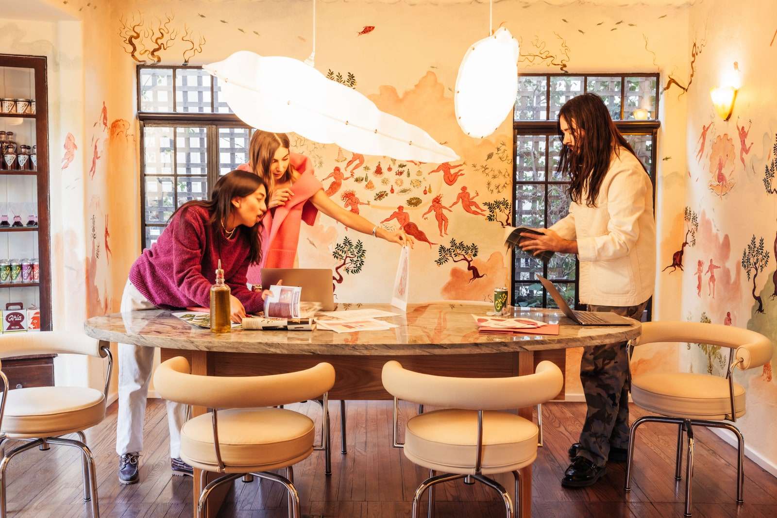 A traditional dining room functions as a meeting place for the Ghia team.