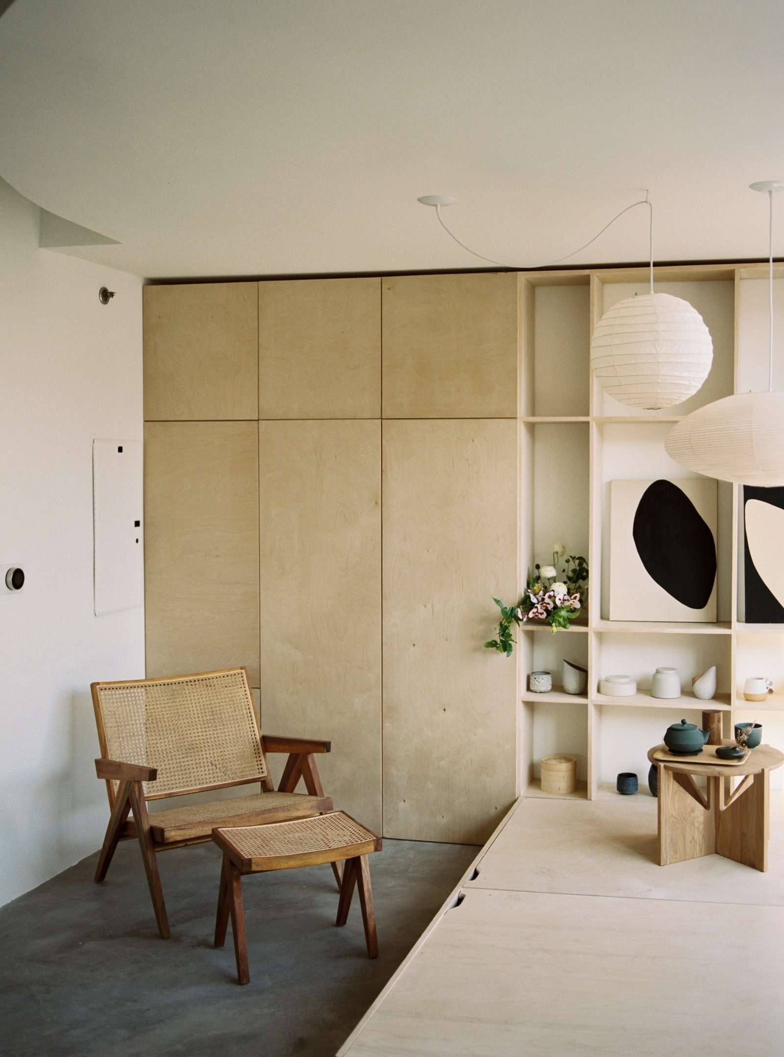 A France and Son chair is placed in the corner of the room.