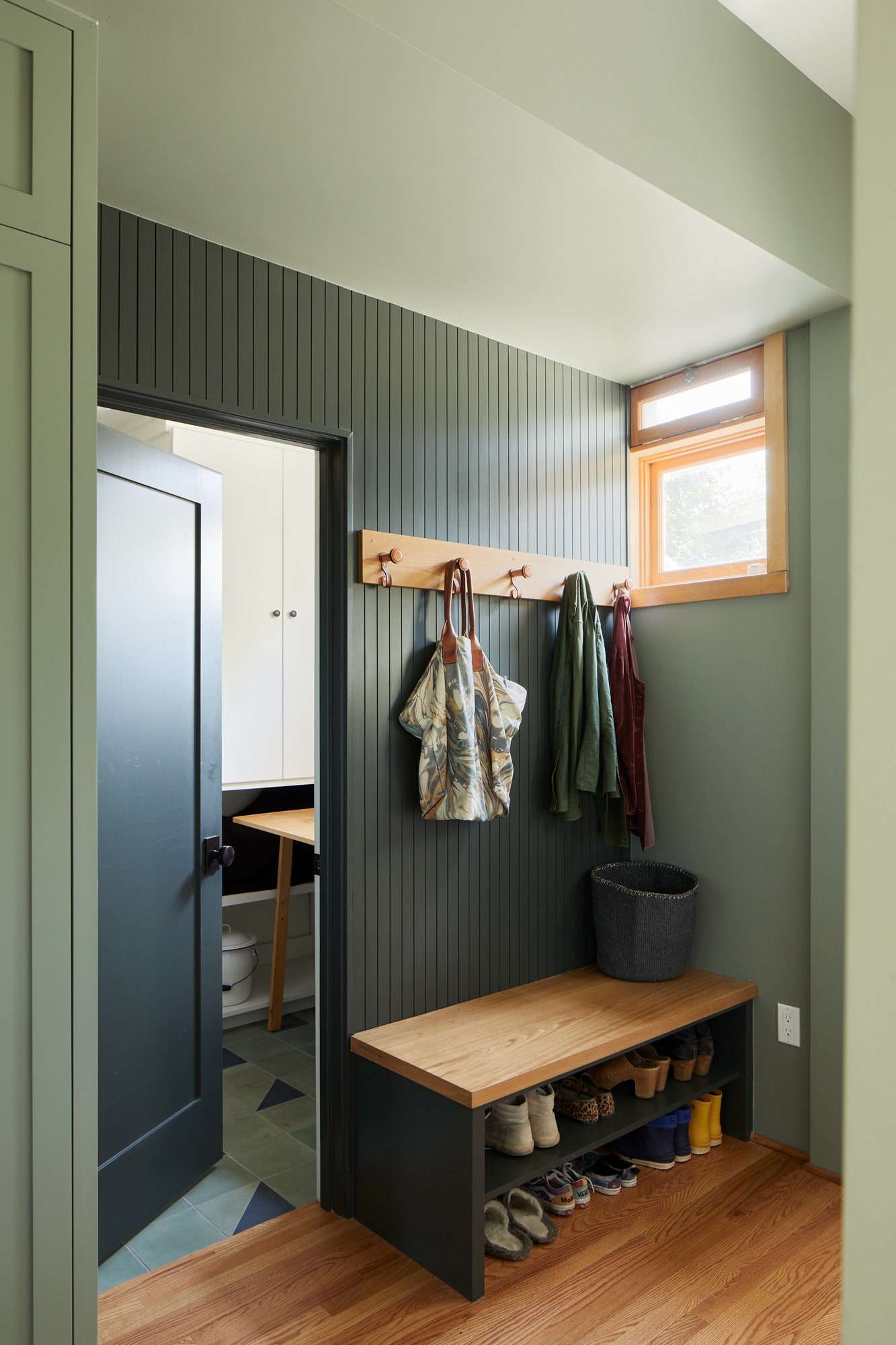 Beadboard and triangular accent tiles appear again in the entryway.