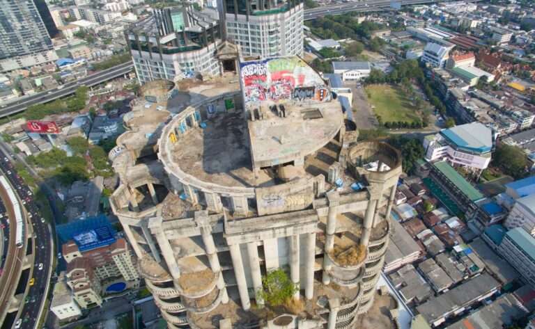 An aerial drone view of the Sathorn Unique Tower or Ghost Tower in Bangkok