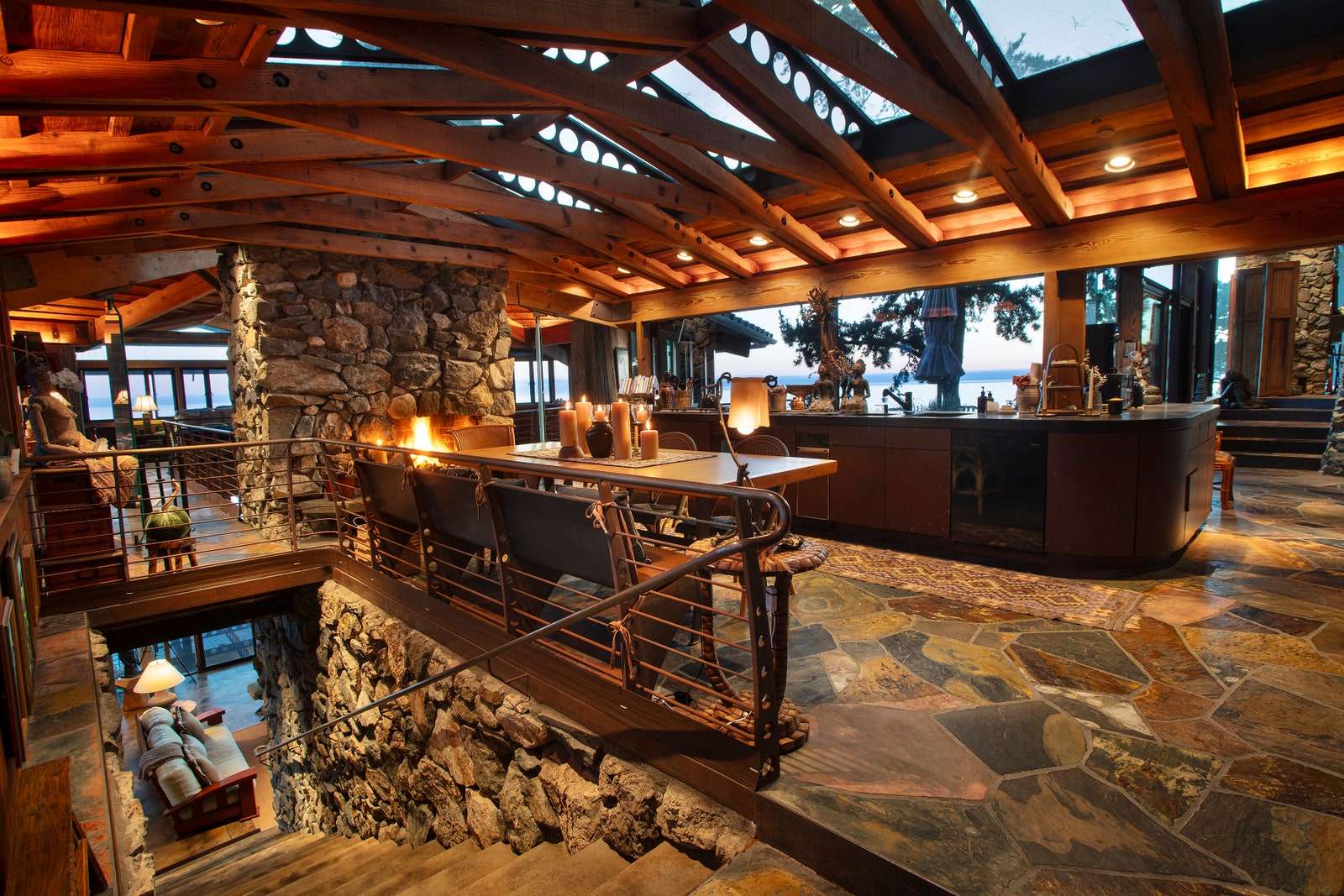 upper floor of home skylights timber trusses stone floors