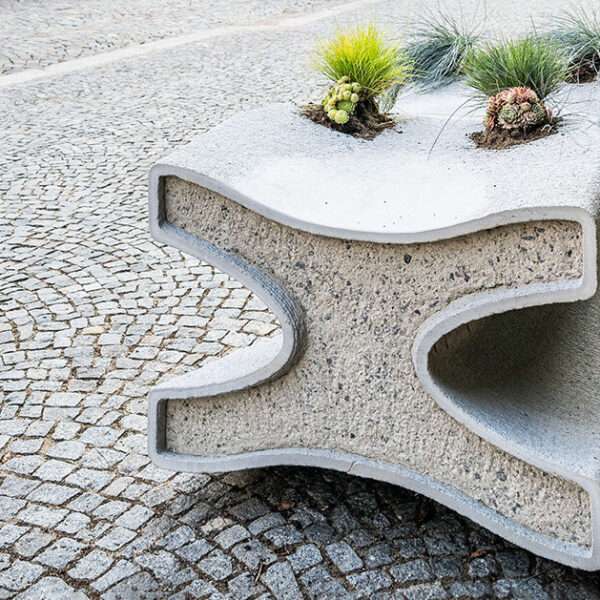 concrete bench X doubles as a planter, reflecting czech republic's gothic heritage