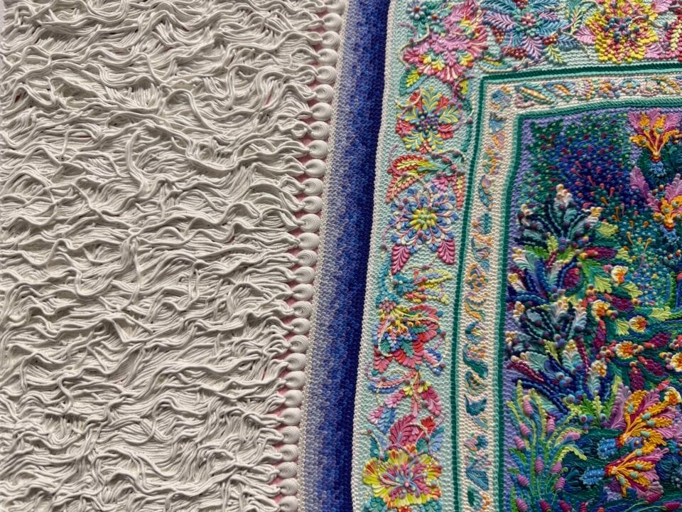 a detail of a hyperrealistic oil painting of a crinkled ornamental carpet fringe