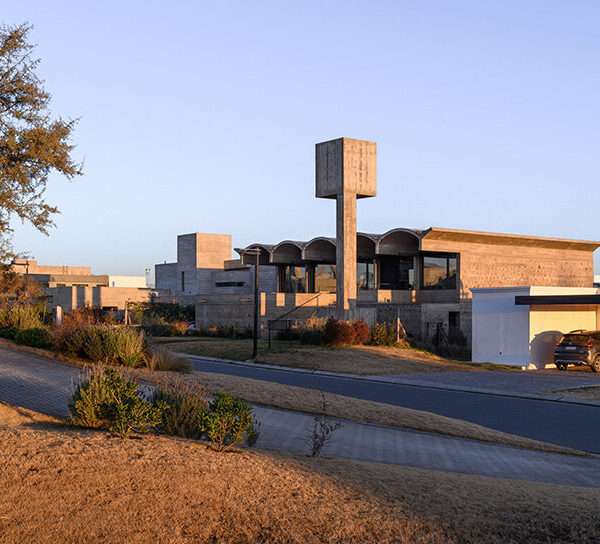 airy vaulted roofs crown robust concrete base of cristián nanzer's residence in argentina