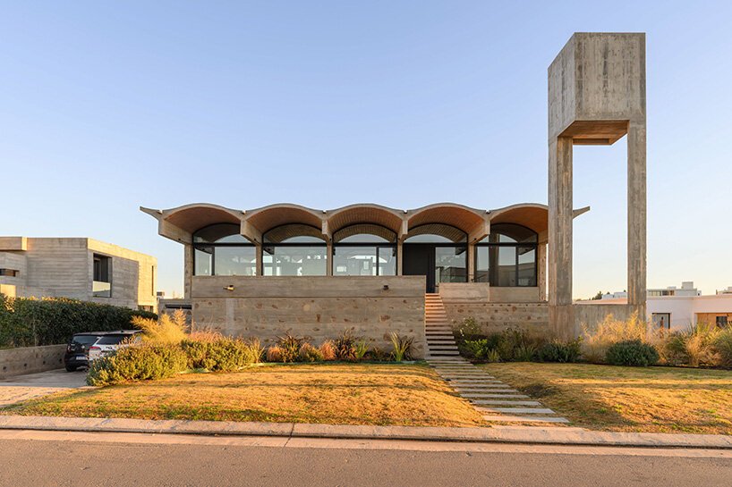 airy vaulted roofs crown robust concrete base of cristián nanzer's residence in argentina