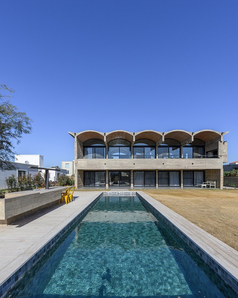 airy vaulted roofs crown robust concrete base of cristián nanzer's residence in argentina