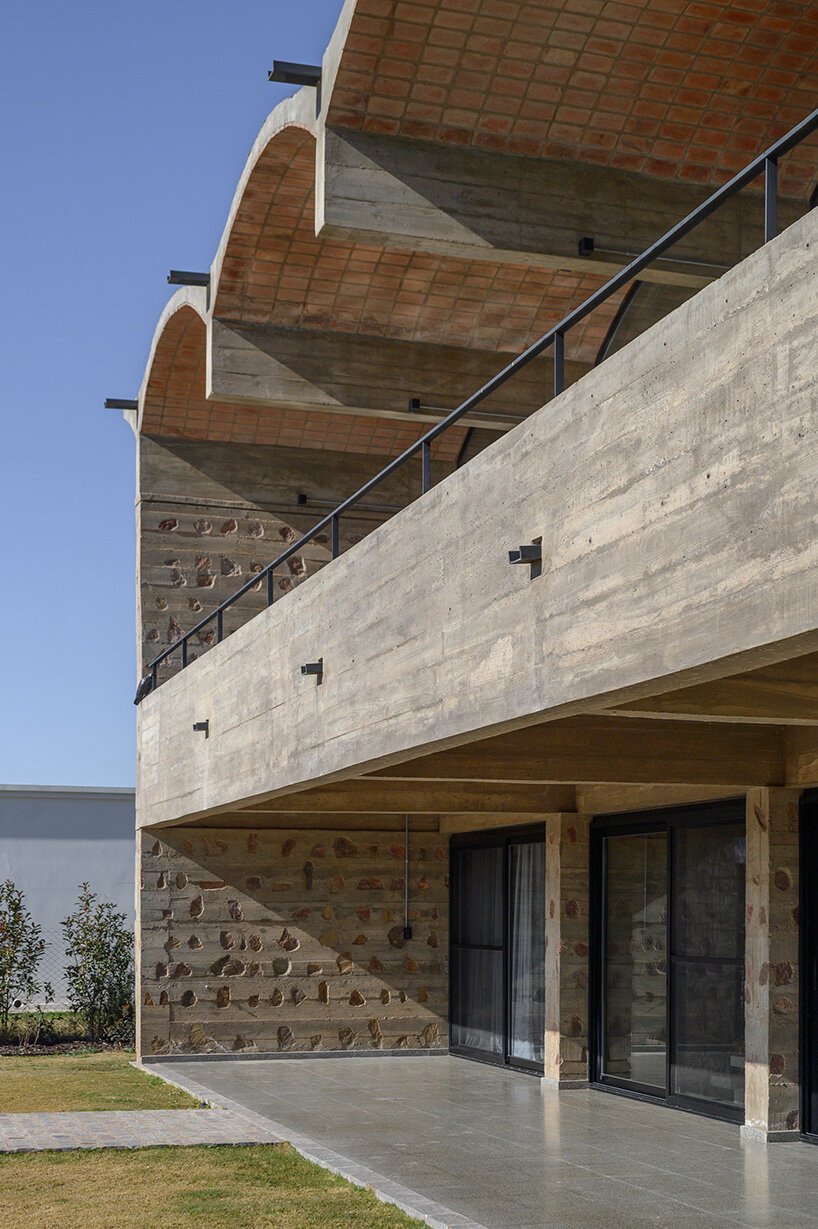 airy vaulted roofs crown robust concrete base of cristián nanzer's residence in argentina