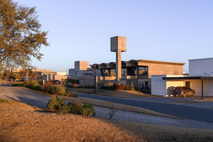 airy vaulted roofs crown robust concrete base of cristián nanzer's residence in argentina