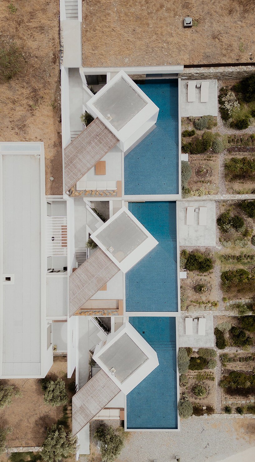 cubic volumes emerge from tinos’ rugged terrain in 'pnoes' hotel by aristides dallas architects