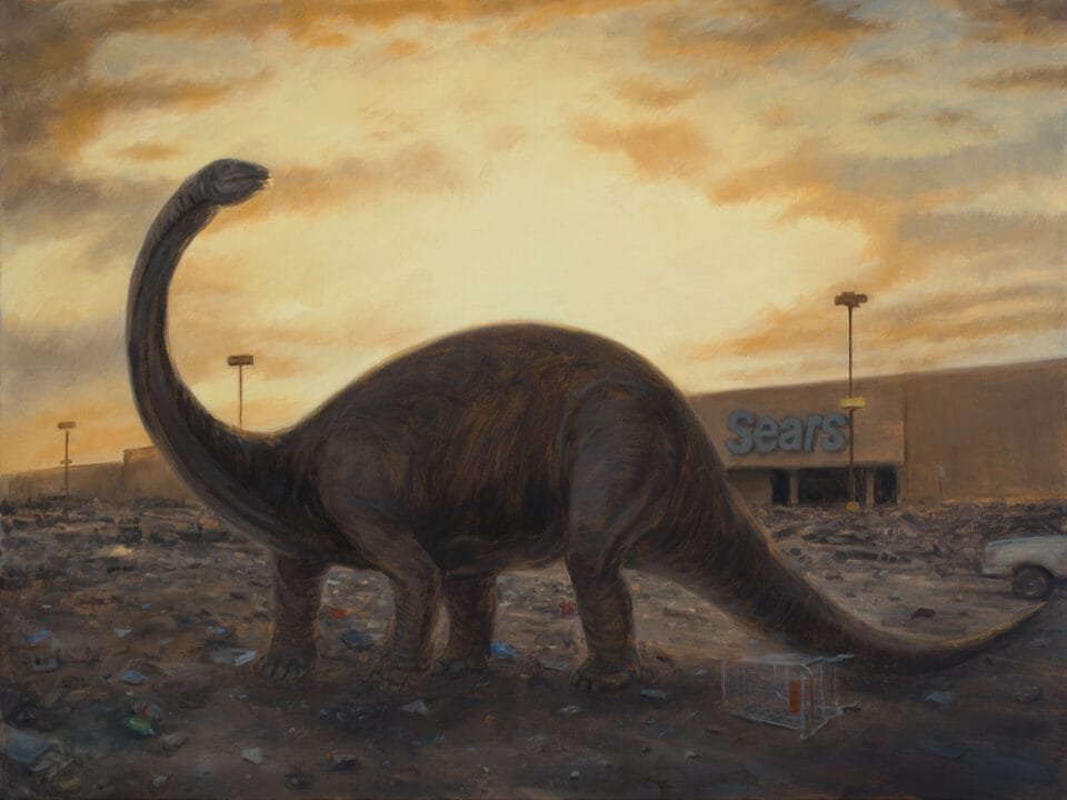 a long-necked dinosaur stands in the parking lot in front of an abandoned Sears