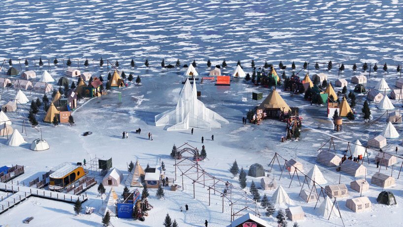 white flame installation's sharp geometry resembles ice crystals along lake in china