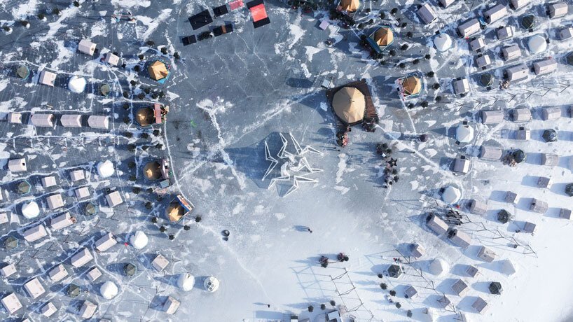 white flame installation's sharp geometry resembles ice crystals along lake in china