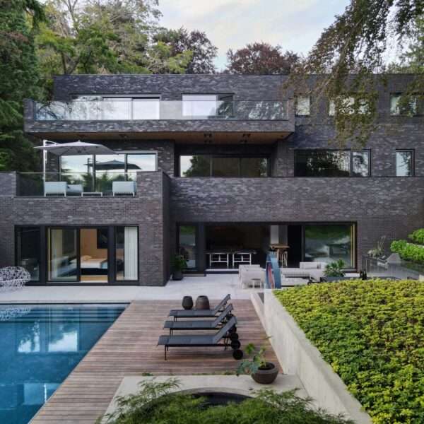 A modern house with a dark brick exterior.