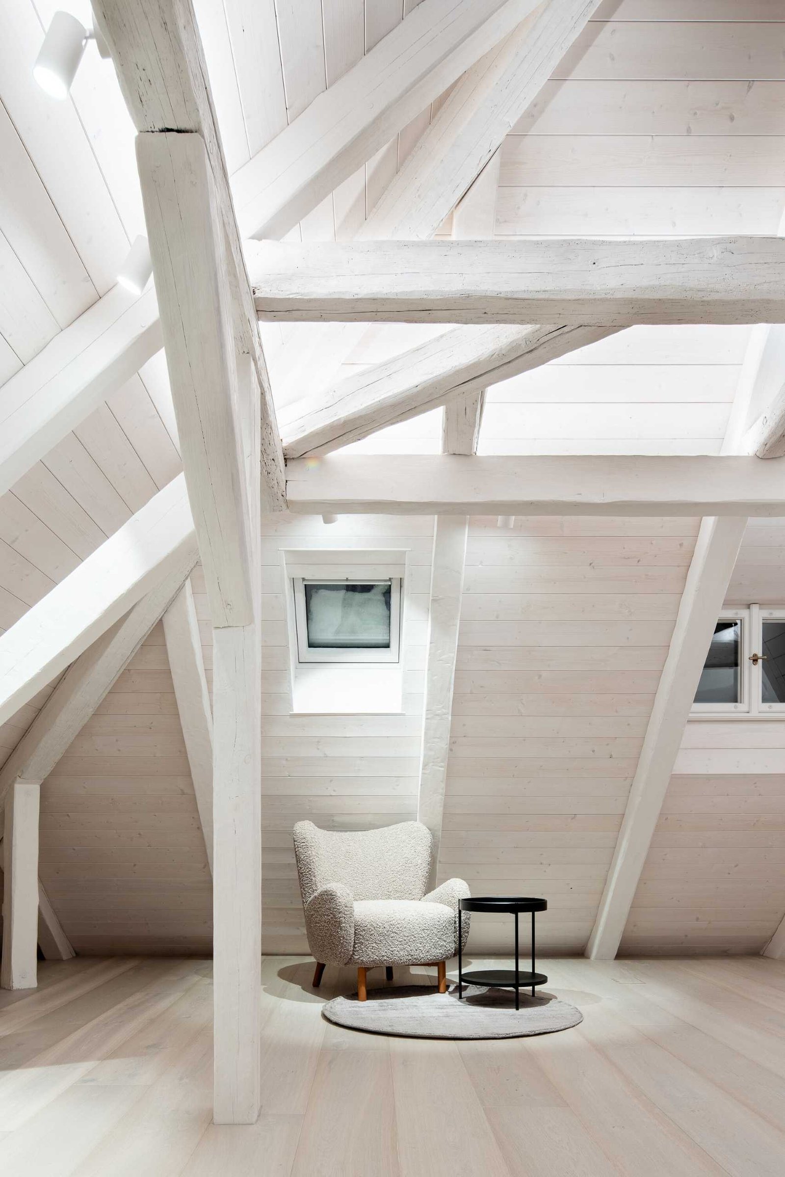 An attic has been transformed into a bedroom suite.