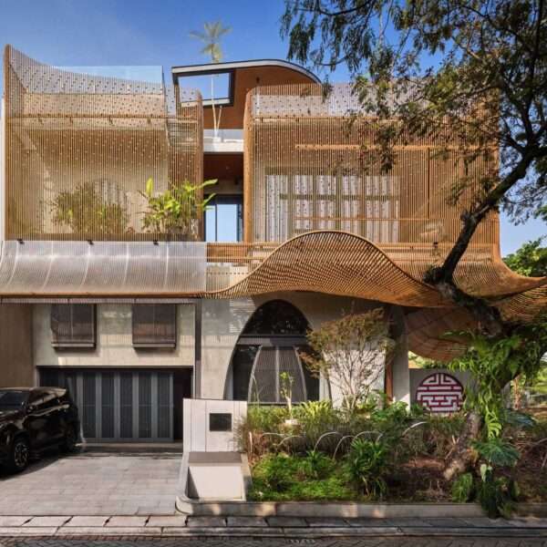 A modern home with operable steel fins on its exterior facade.