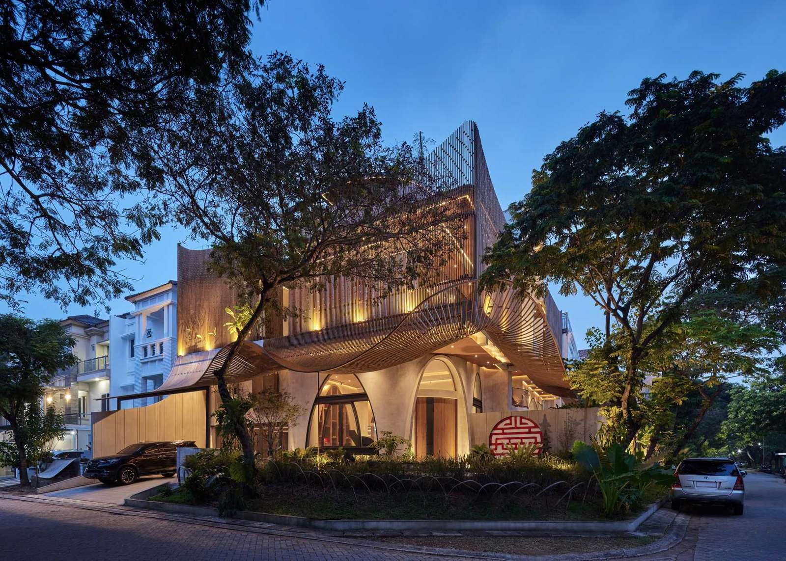 A modern home with operable steel fins on its exterior facade.