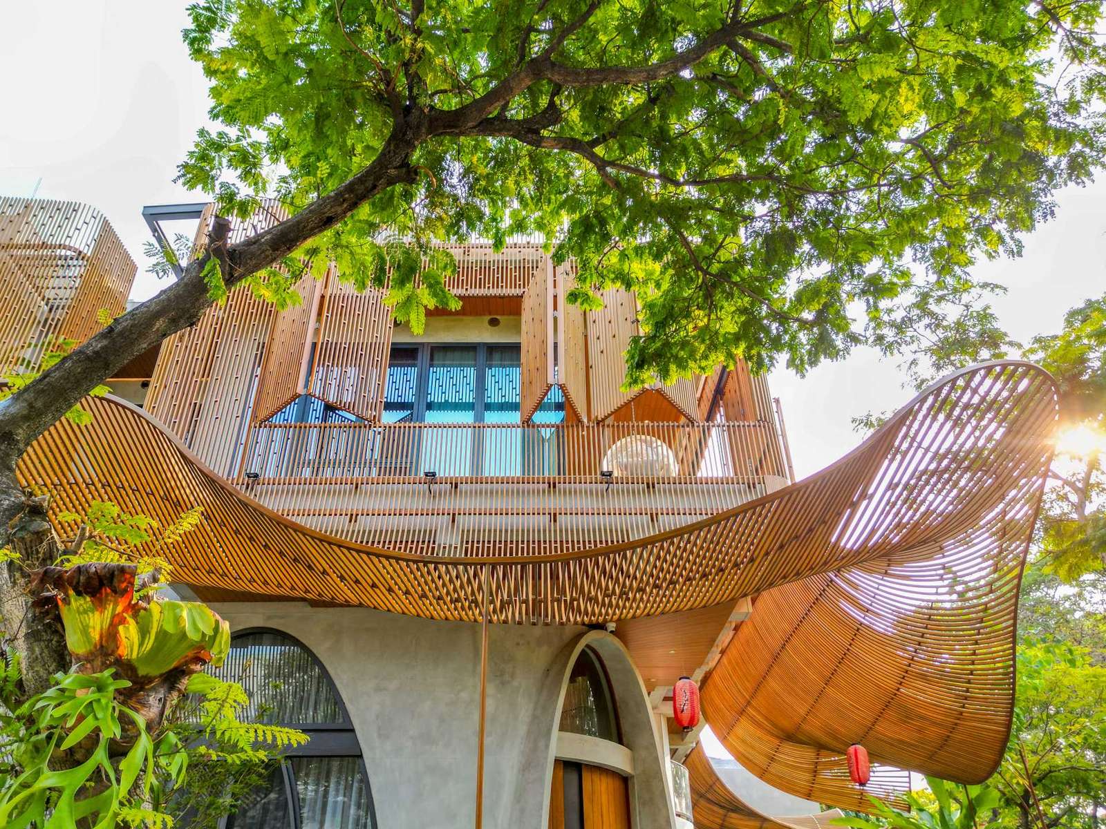 A modern home with operable steel fins on its exterior facade.