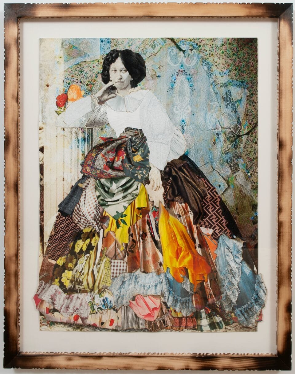 a collage of black and white photos and colorful textiles in a carved wooden frame. the photo depicts a woman in a full skirt