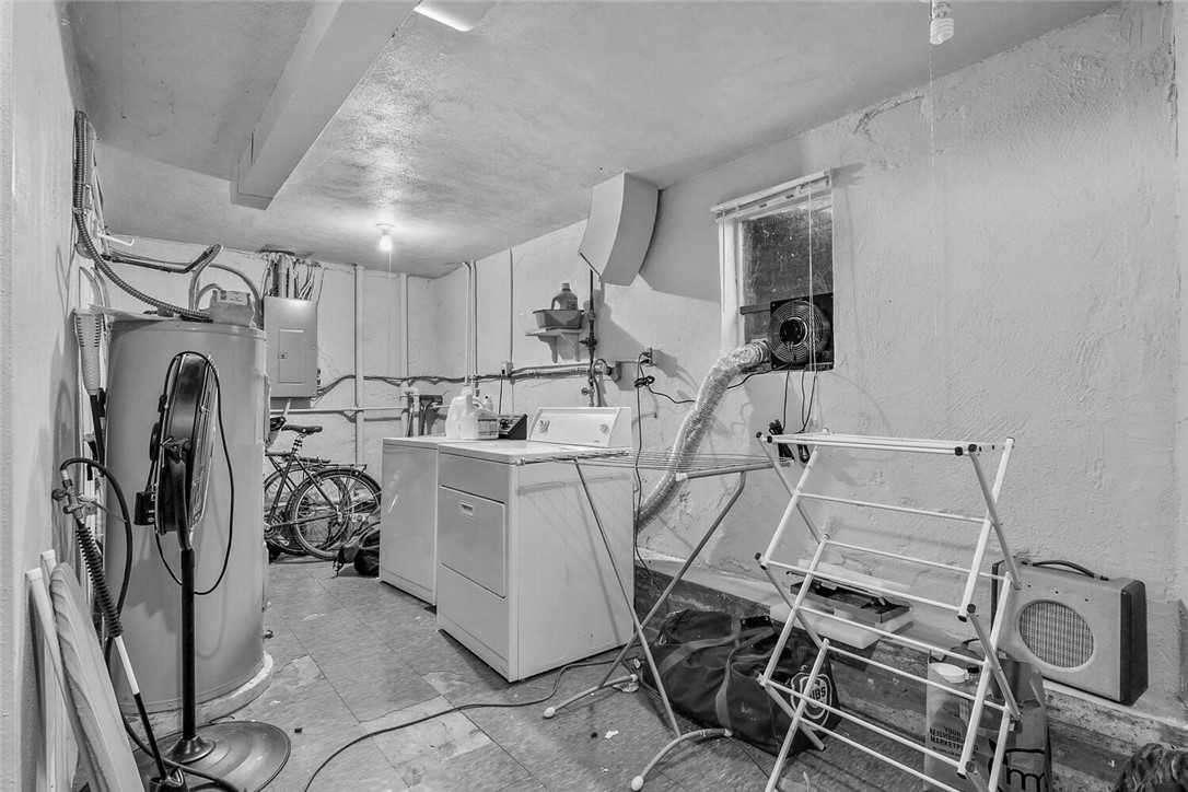 Before - a dated lower level with laundry.