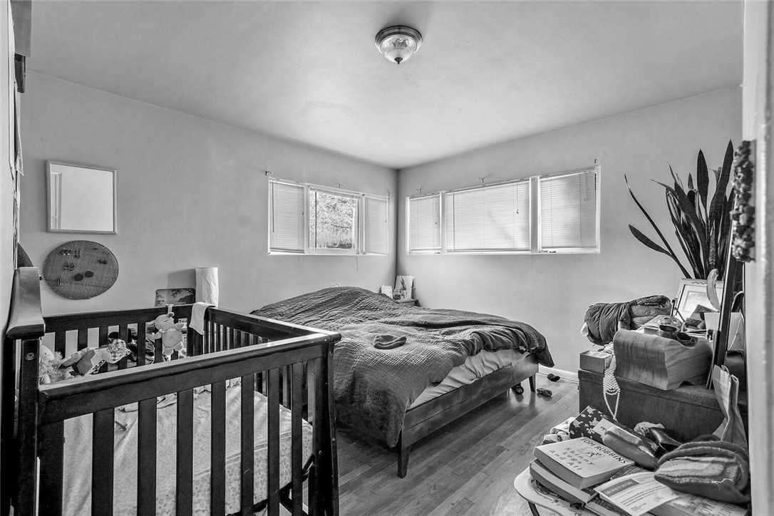 Before - a bedroom with dated fixtures.