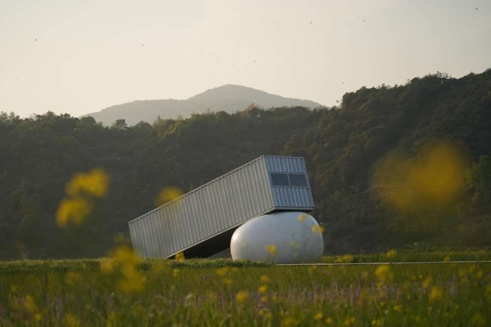 trio of inflated pavilions create rural café, cinema, and library amid rice fields in china