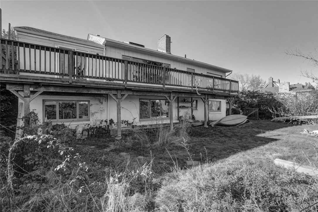 Before - a dated house and backyard.
