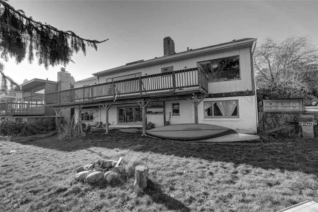 Before - a dated house and backyard.