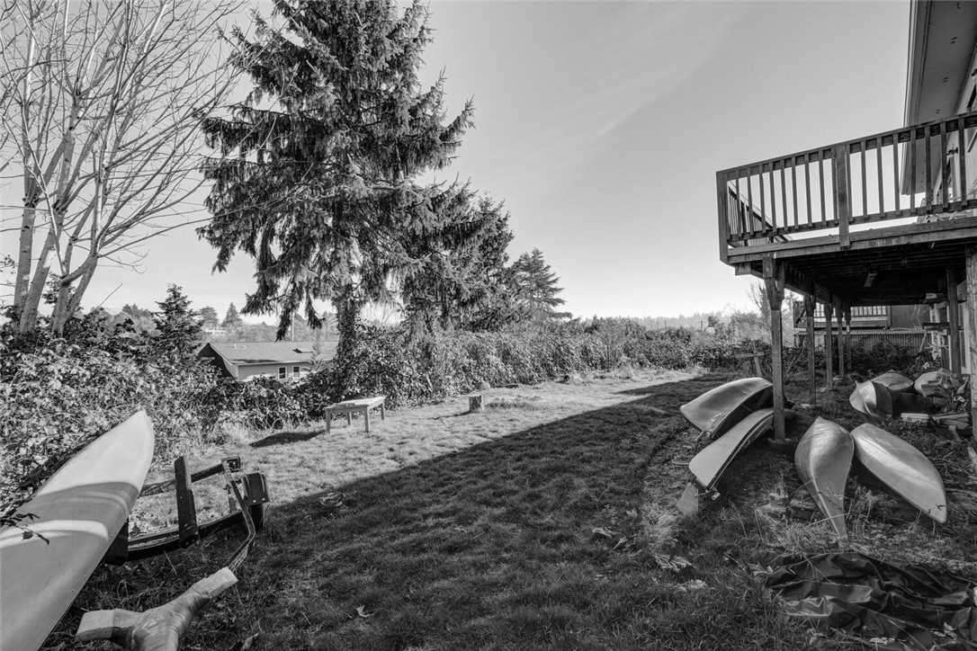 Before - a dated house and backyard.